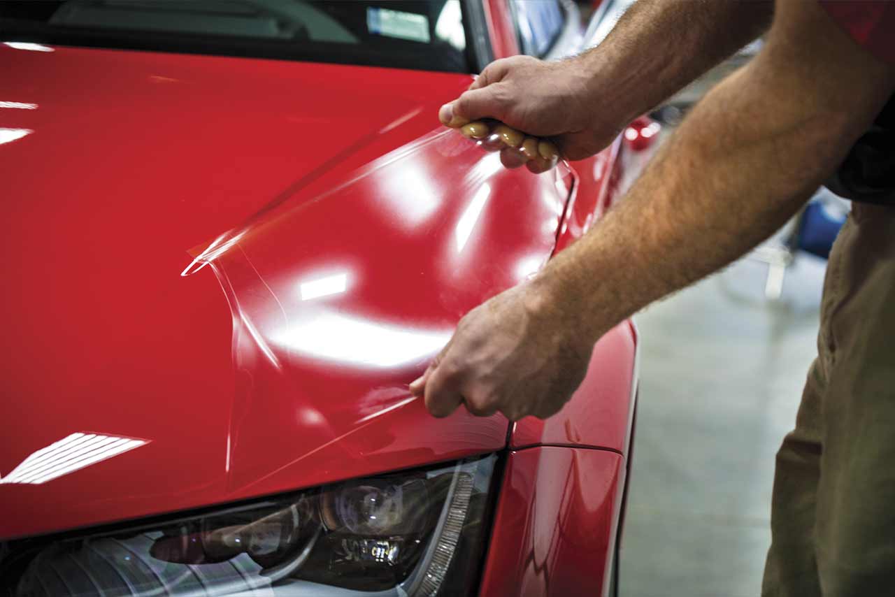 PPF installation on a red car